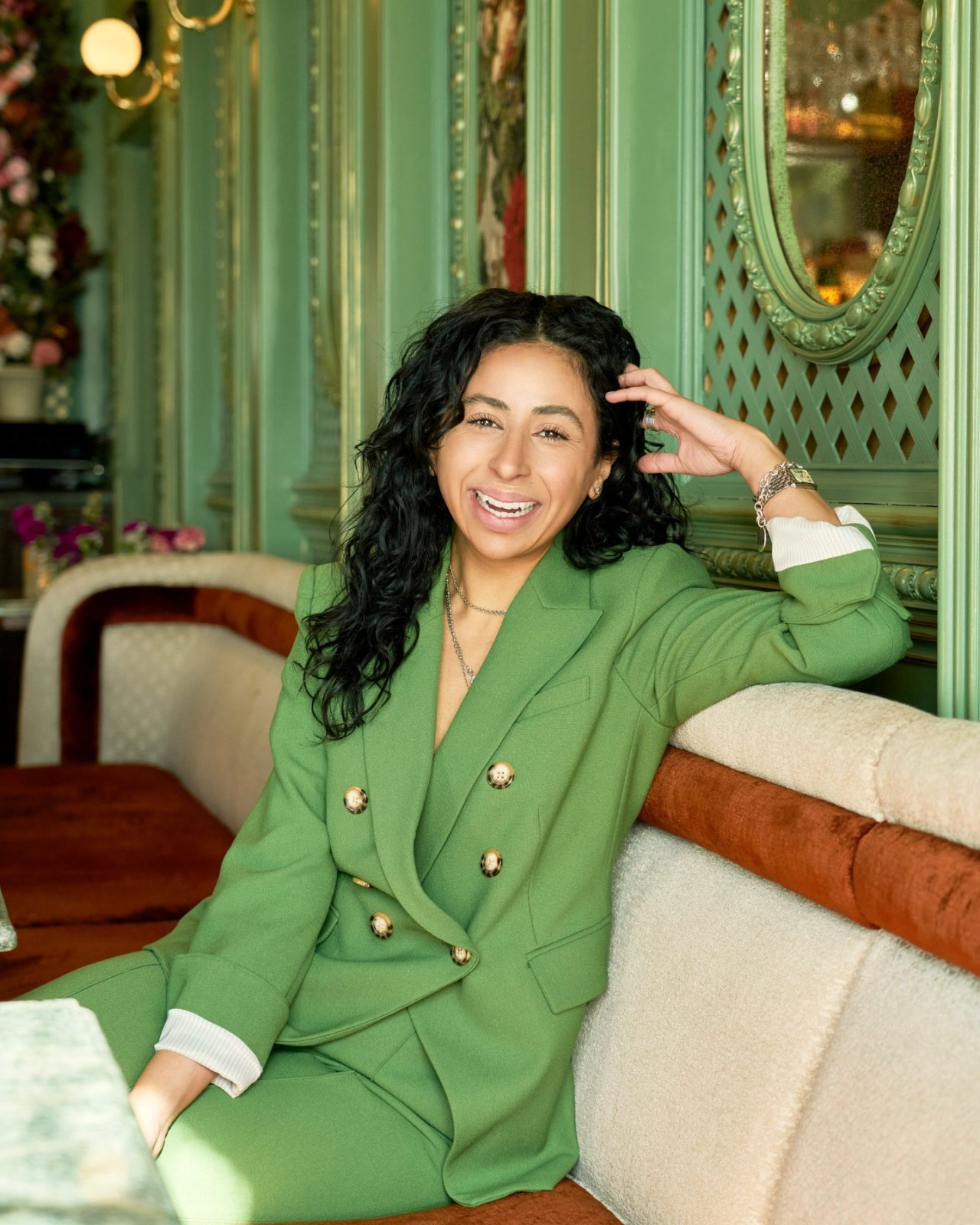 hailey george, founder and principal of hghr, in a green suit